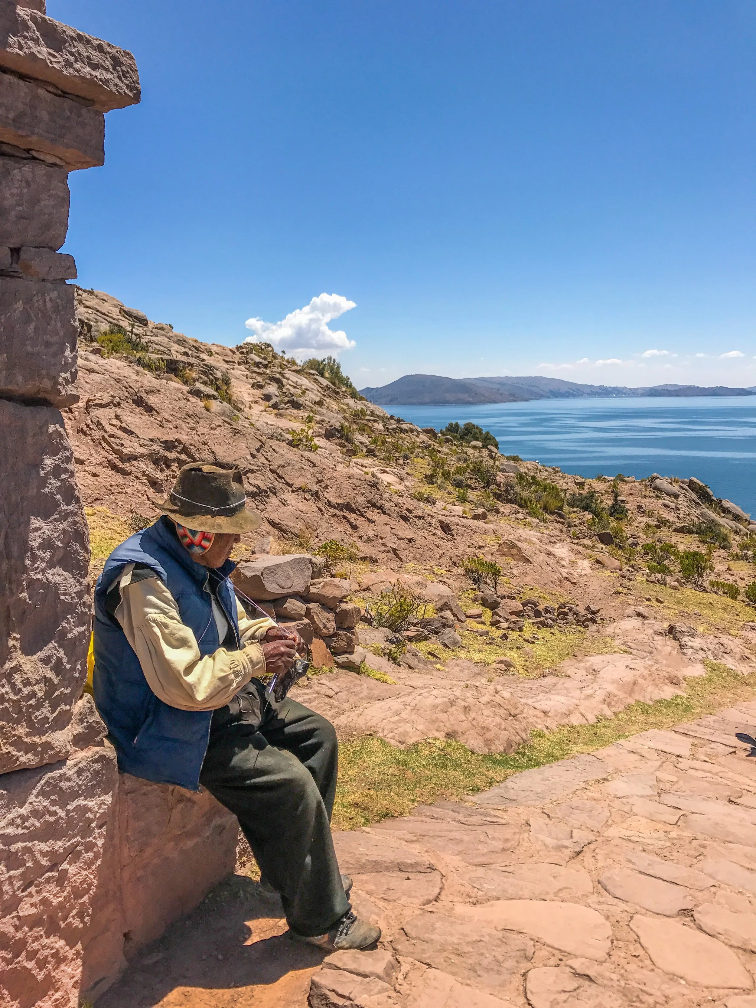 An elder Taquile man knitting