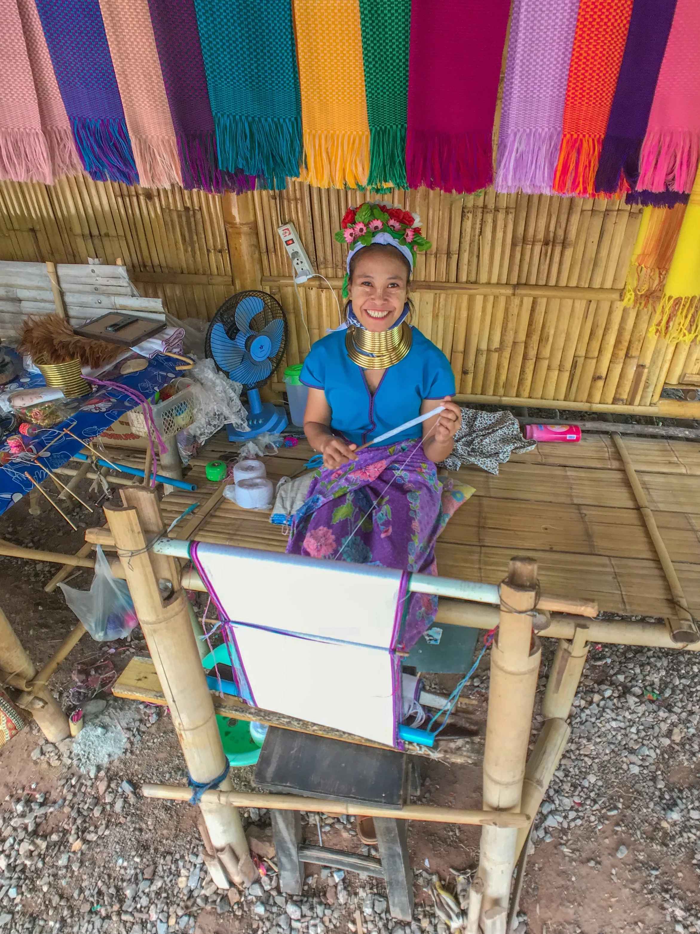 A "dragon lady" smiles inside one of Thailand's human zoos
