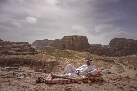 A vendor relaxing in Petra