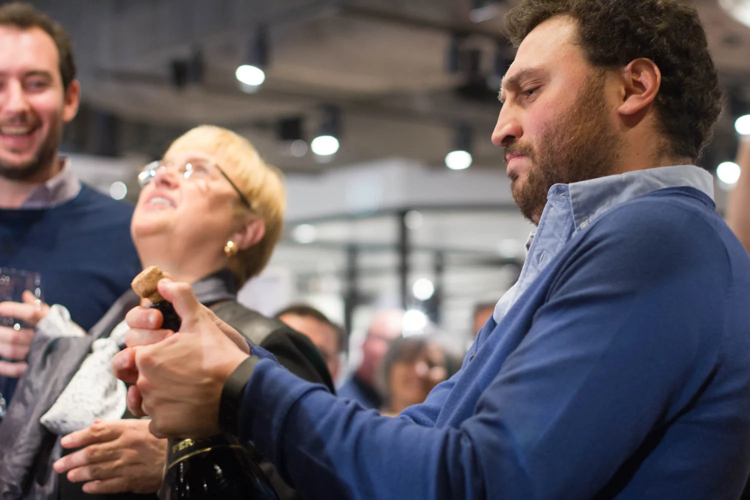 Eataly CEO Nicola Farinetti celebrates Tuesday’s ribbon cutting ceremony by opening a bottle of champagne. 