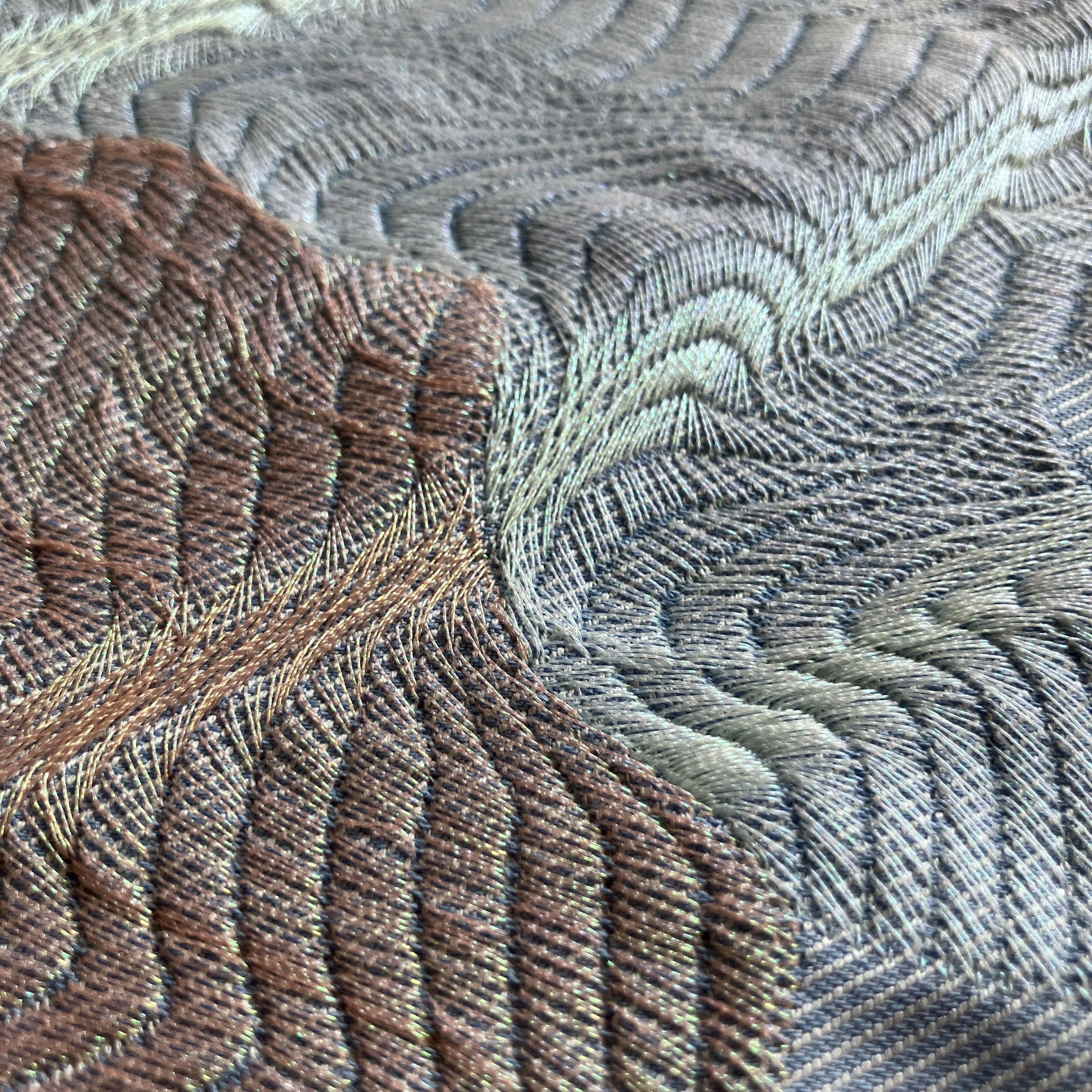 Design: Caroline Jones. On the left embroidered with iridescent METY shades
