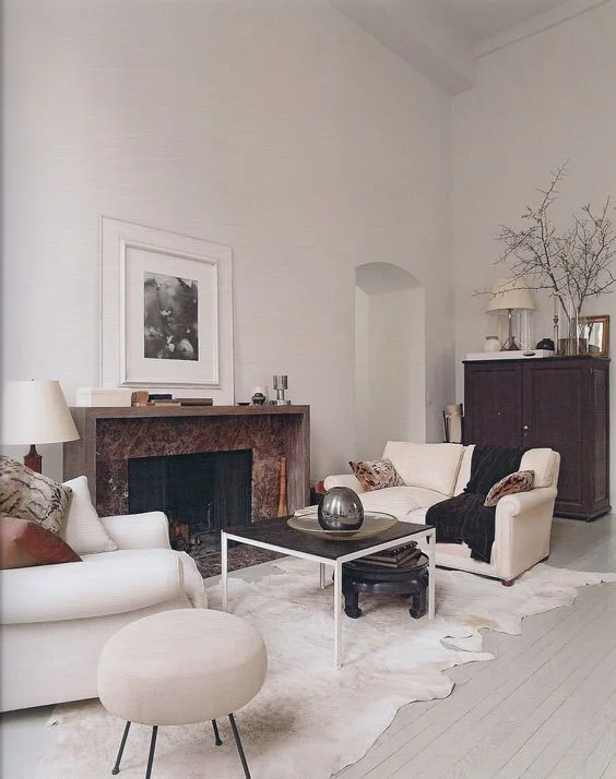 Designer Thomas O'Brien uses one large piece of art and keeps the remaining wall space empty and serene. 