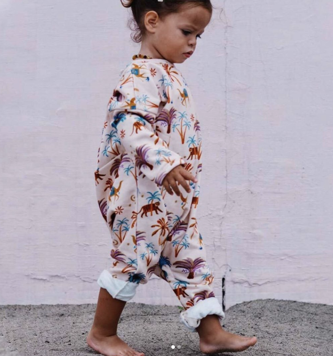 A romper Rosie designed for Oak Meadow Kids .