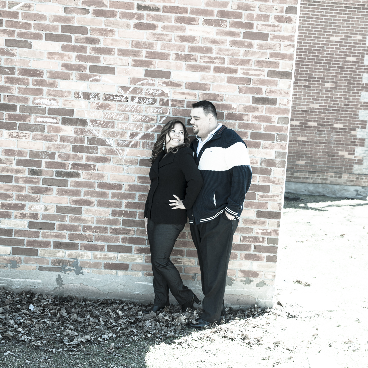 Richmond Green Engagement photo against brick wall