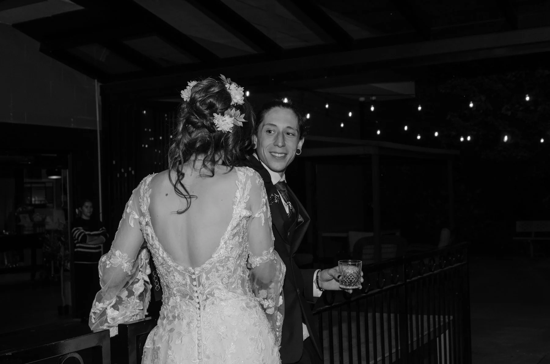 Groom looking at bride black and white