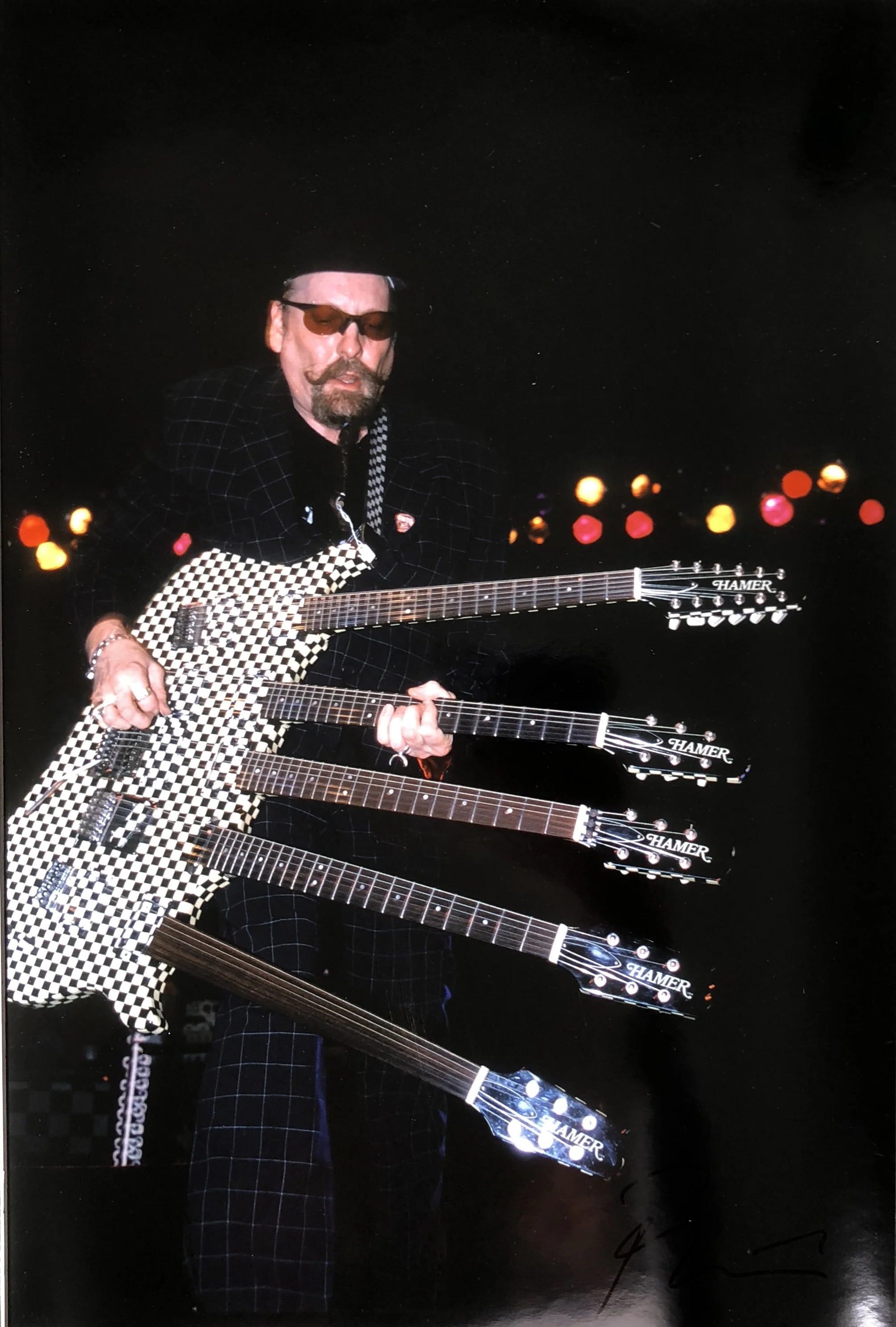 Rick Nielsen from Cheap Trick with 5 Guitar. c. late 1990s Madison Square Garden. 19_ x 12.5_. Signed in black bottom right.jpg