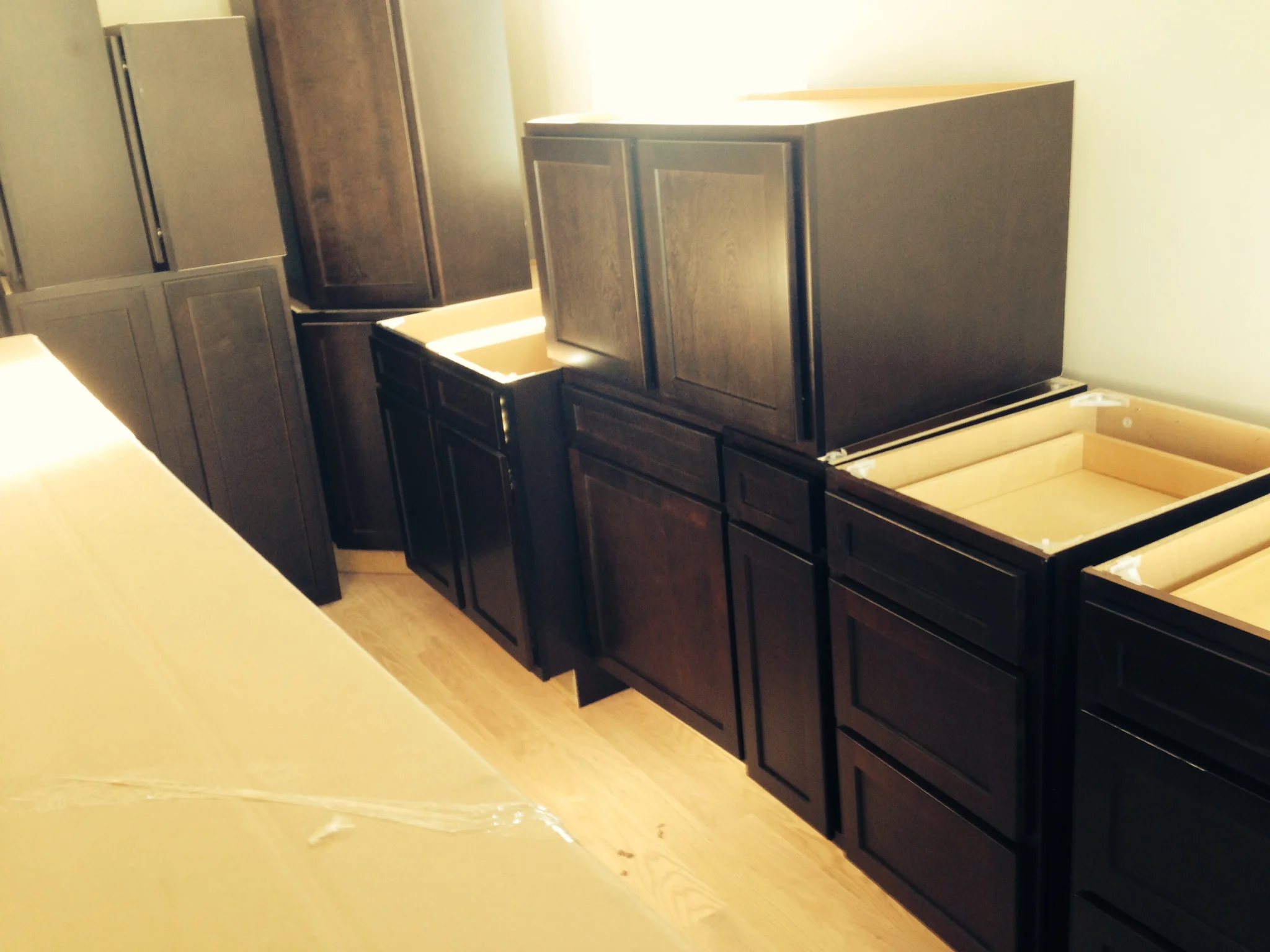 We installed gorgeous dark wood cabinets in the kitchen.