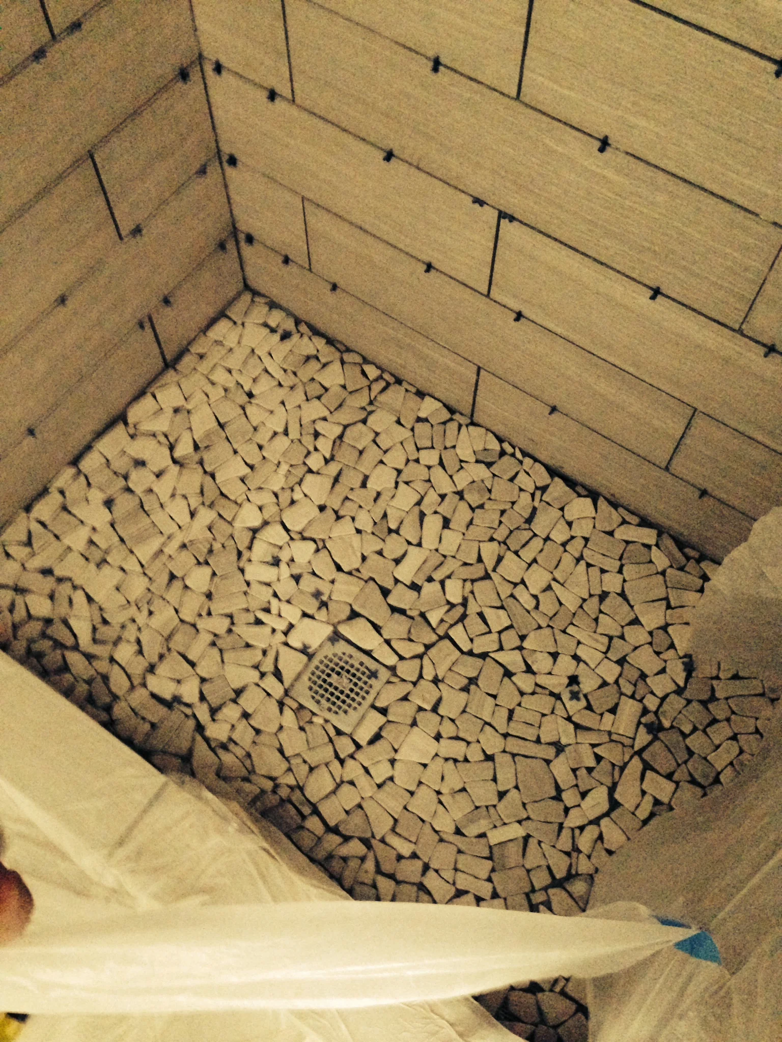 We loved these natural looking stone tiles for the shower floor.