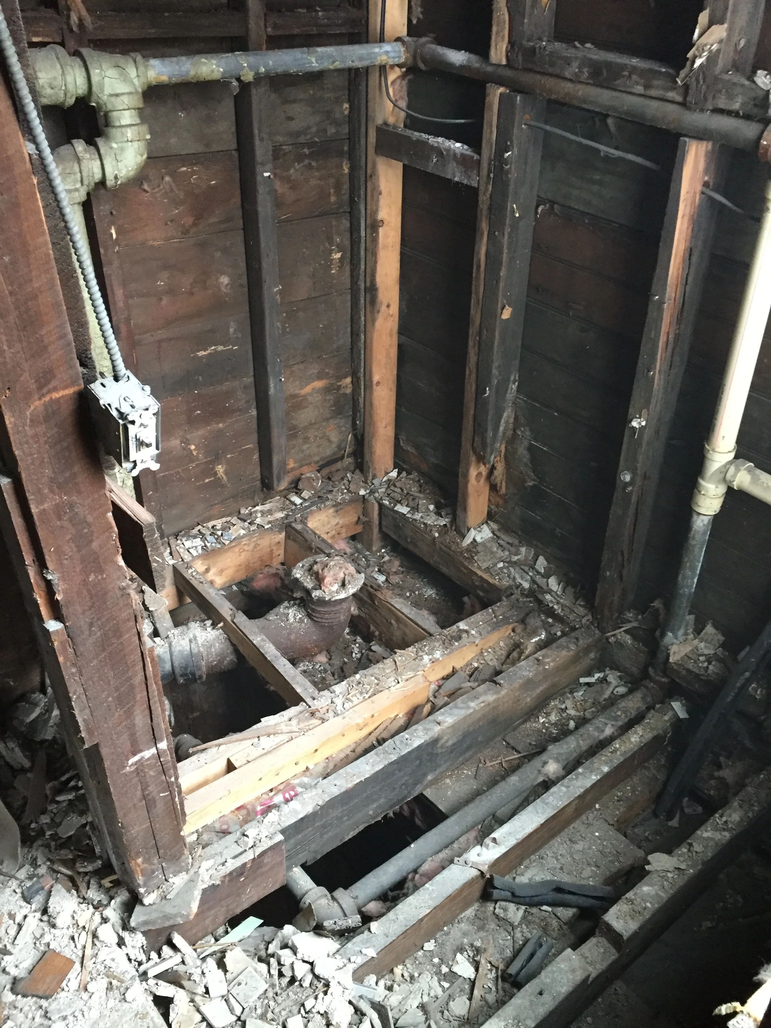 Gutting the bathrooms exposed a lot of old plumbing that we will need to replace.