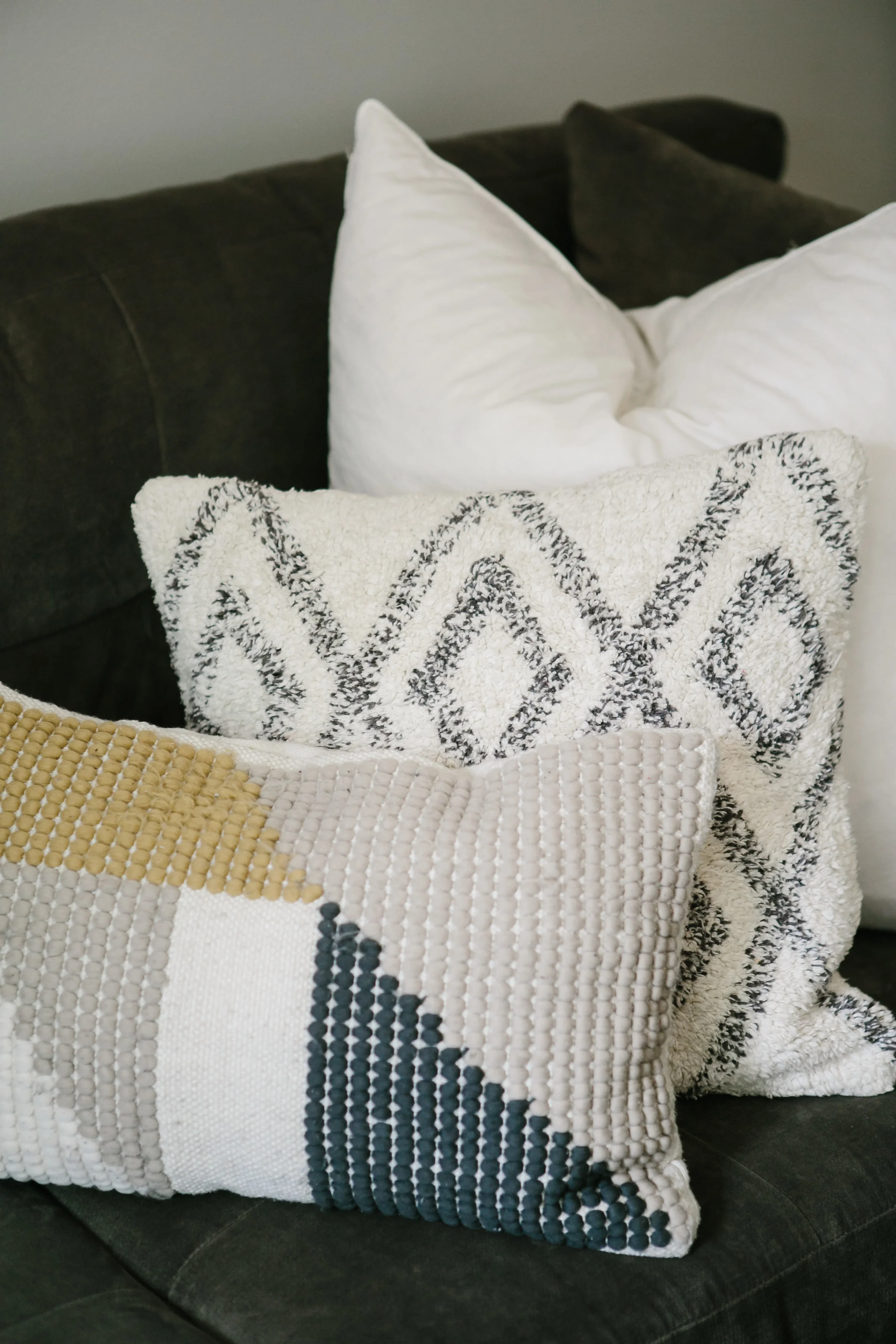 Throw pillows on a large crate and barrel sectional.