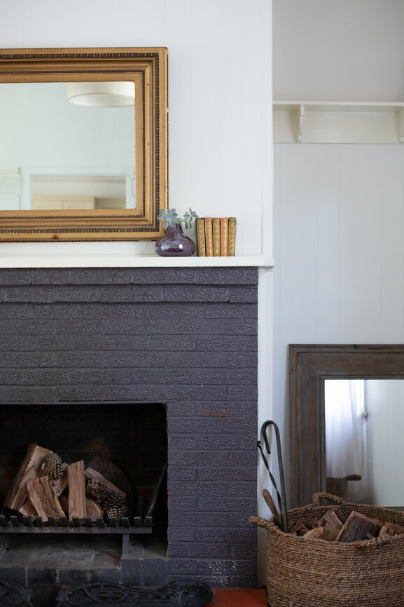 dark green painted brick fireplace