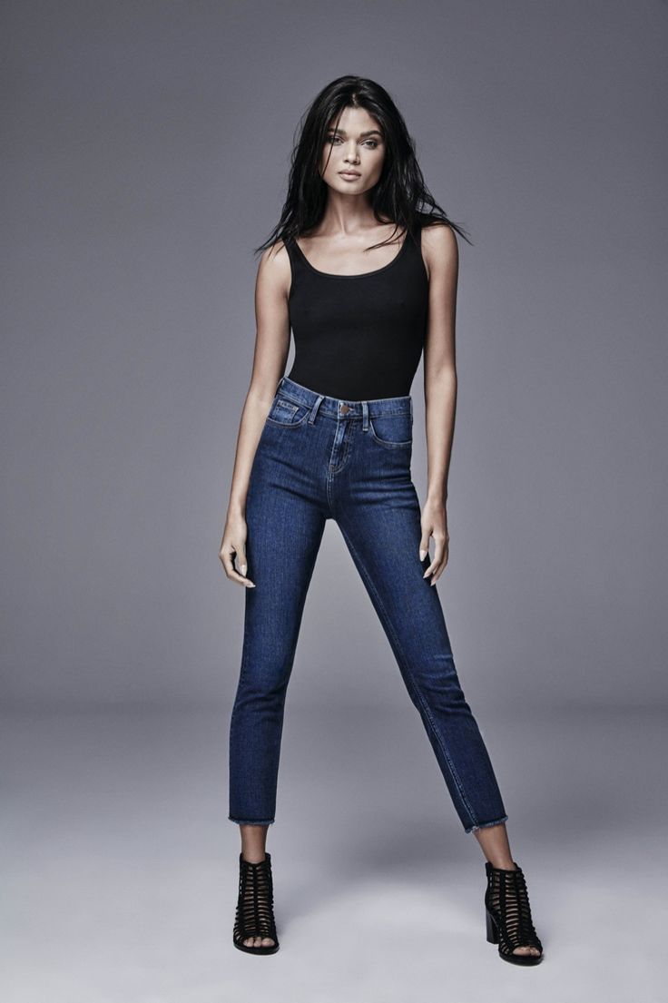 Portrait Female Model Posing Trendy Denim Jeans Dark Background Stock Photo  by ©gorgev 555383064