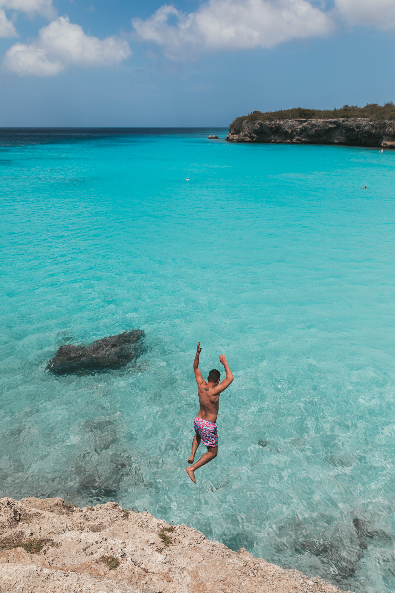 Cliff jumping at Playa Knip on Curaçao // 20 Photos to Show You Why Curaçao Needs to Be On Your Travel Radar // www.readysetjetset.net #readysetjetset #curacao #caribbean #beach #ocean #paradise #travel