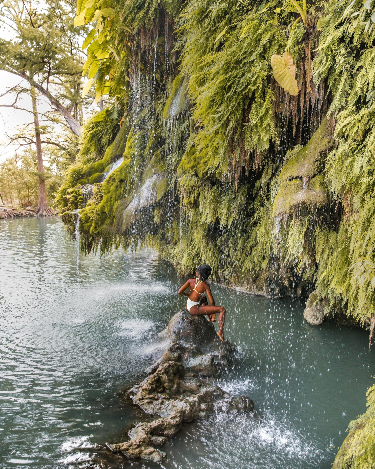 Krause Springs: One of the Best Swimming Holes in Texas // Krause Springs is a natural swimming hole just outside of Austin in Spicewood, Texas. It's beautiful waterfall and cool temperatures make it one of the best swimming spots in the Texas Hill …