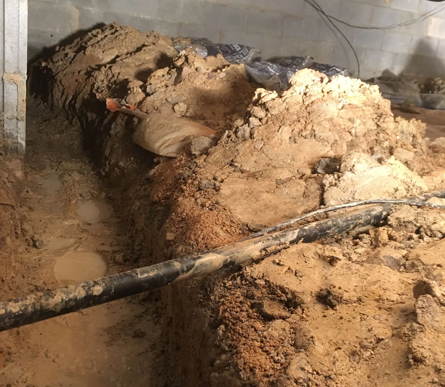 Drainage trench dug and ready for gravel and drain line.