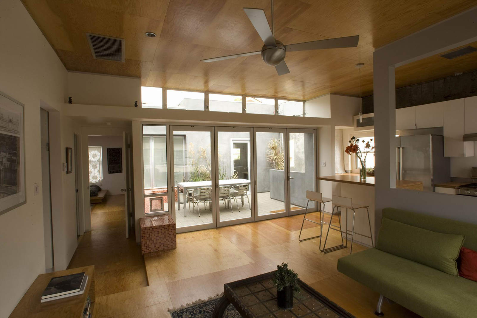 A view of the living room looking back out towards the courtyard.