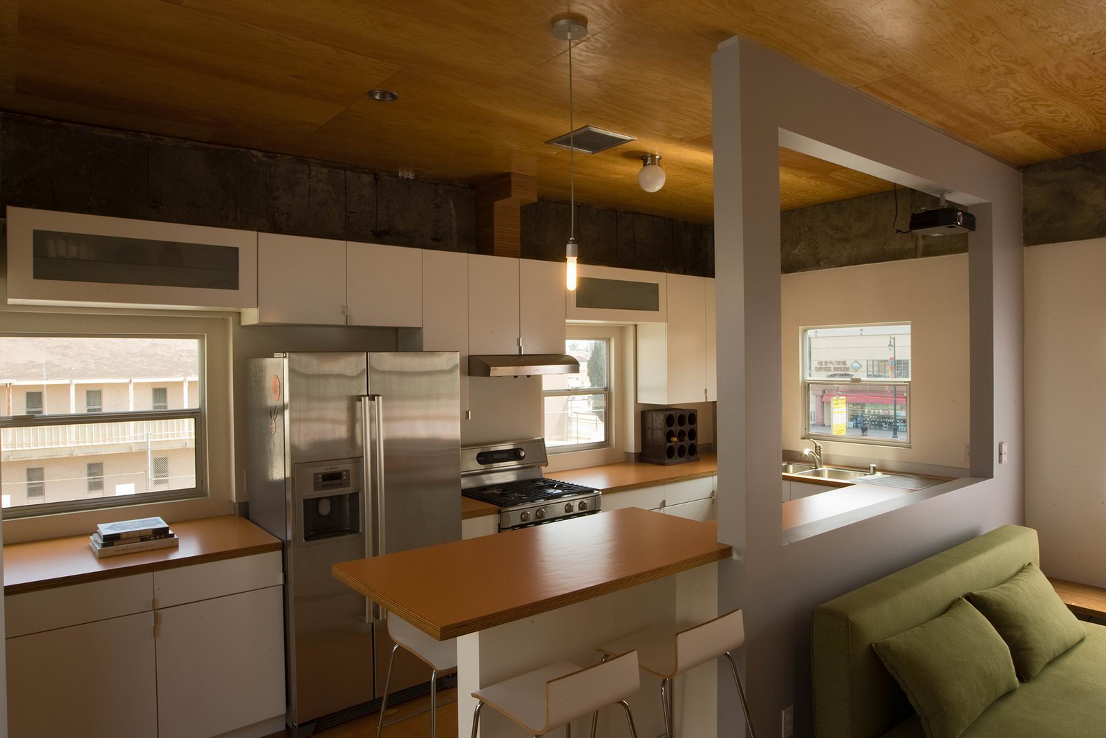 The kitchen, designed for maximum functionality while maintaining total openness towards the living room.
