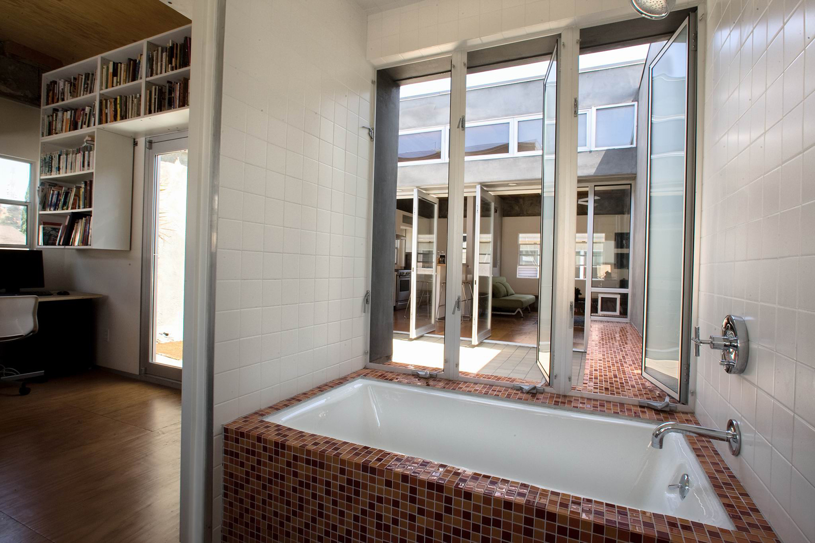 The master bath takes maximum advantage of the private outdoor courtyard to provide an indoor-outdoor bathing experience.