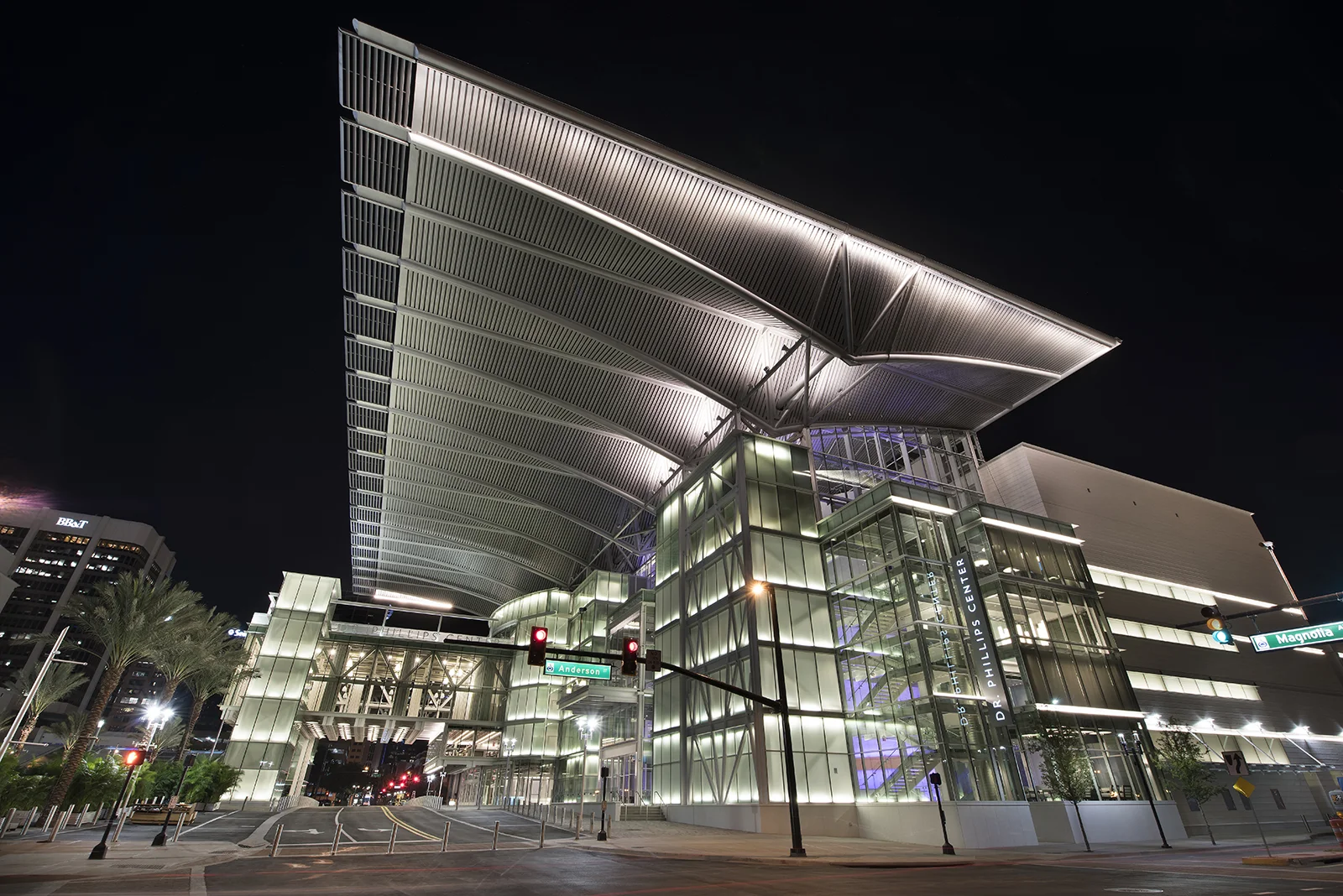 The Dr. Phillips Center is a performing arts center occupying a full block in central Orlando, FL. It houses three performance halls, and features a roof which cantilevers 75' over the city below.
