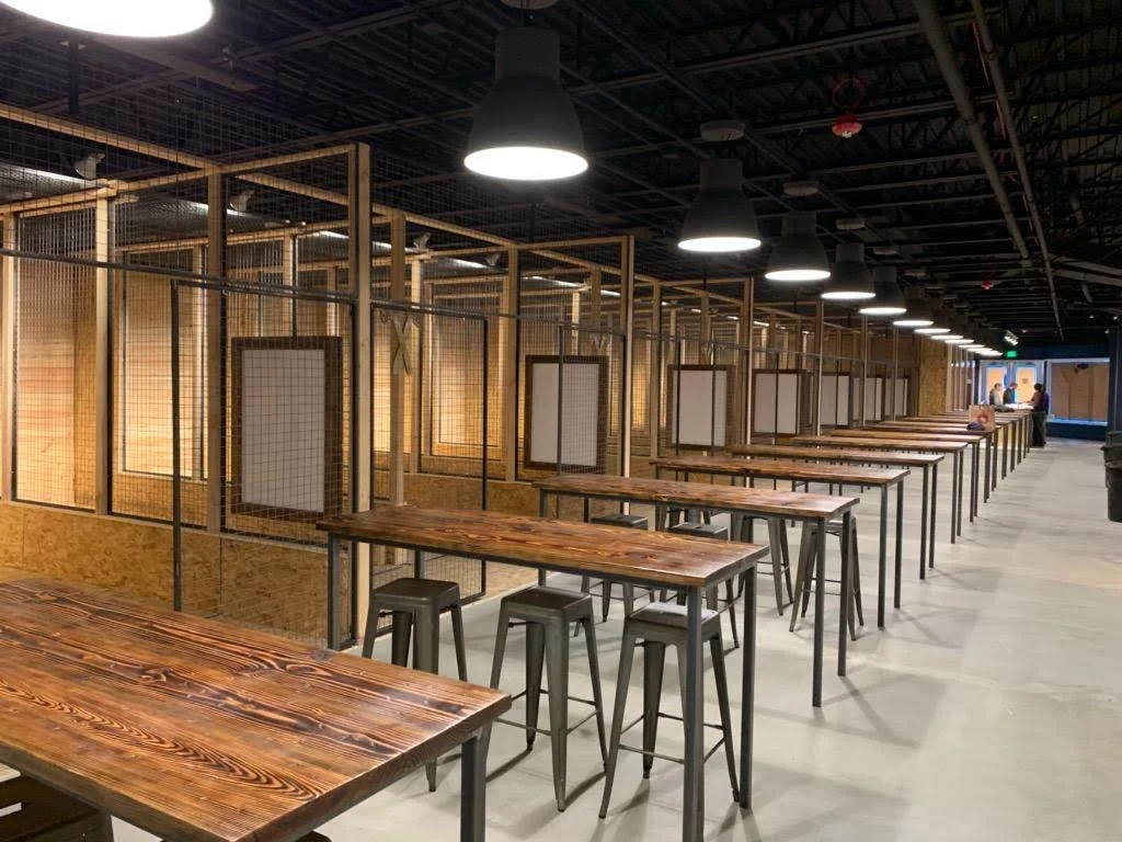 A view of some of the 18 axe throwing lanes and the seating area which can accommodate close to one hundred people