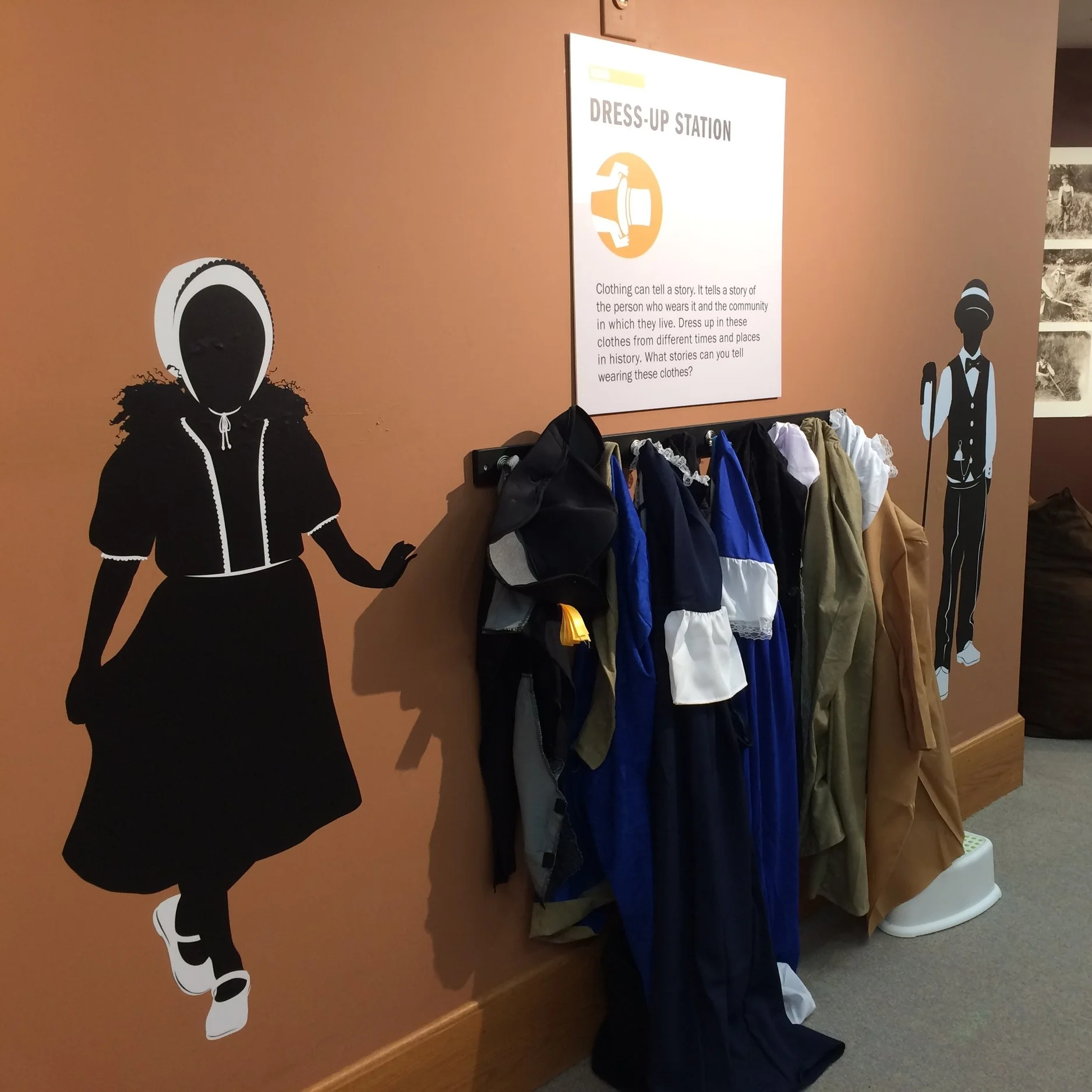 A dress-up station allows younger visitors to step into the fashions of early Oregonians.