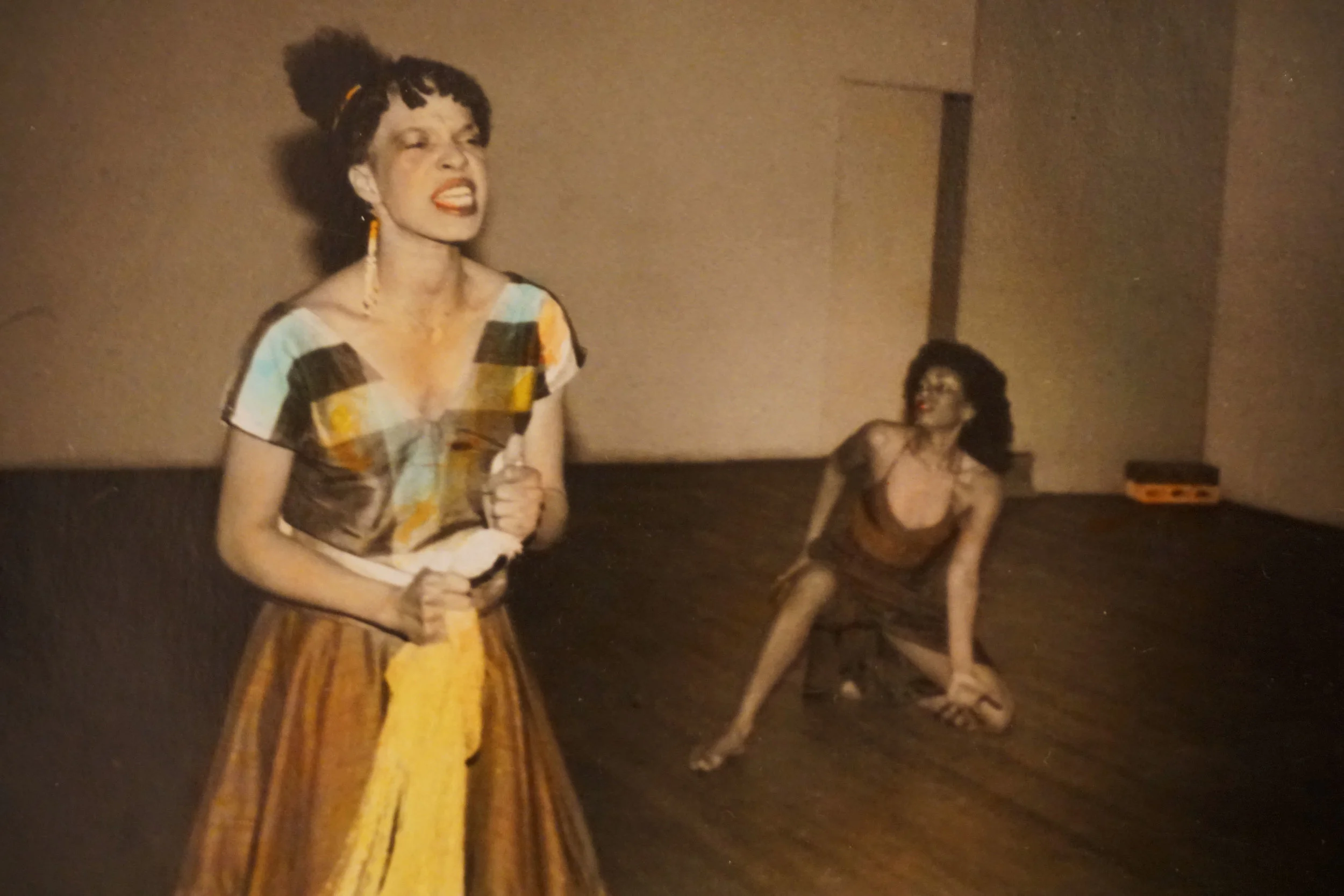 Hand colored B/w Photo taken by Nina Kuo at Basement Wkshop c 1980’s with Jessica Hagedorn and Thulani Davis etc.