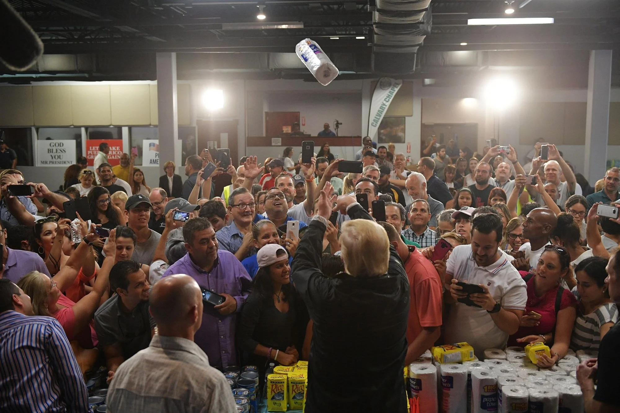 Trump throws a roll of paper towels at a press conference in Puerto Rico following the hurricane - NBC