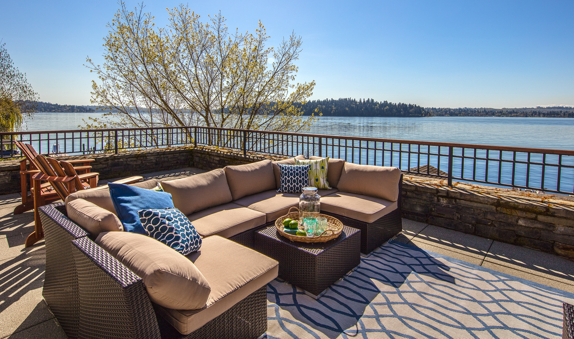 Photo of back patio of lakefront PNW home designed by Seattle Residential Architect
