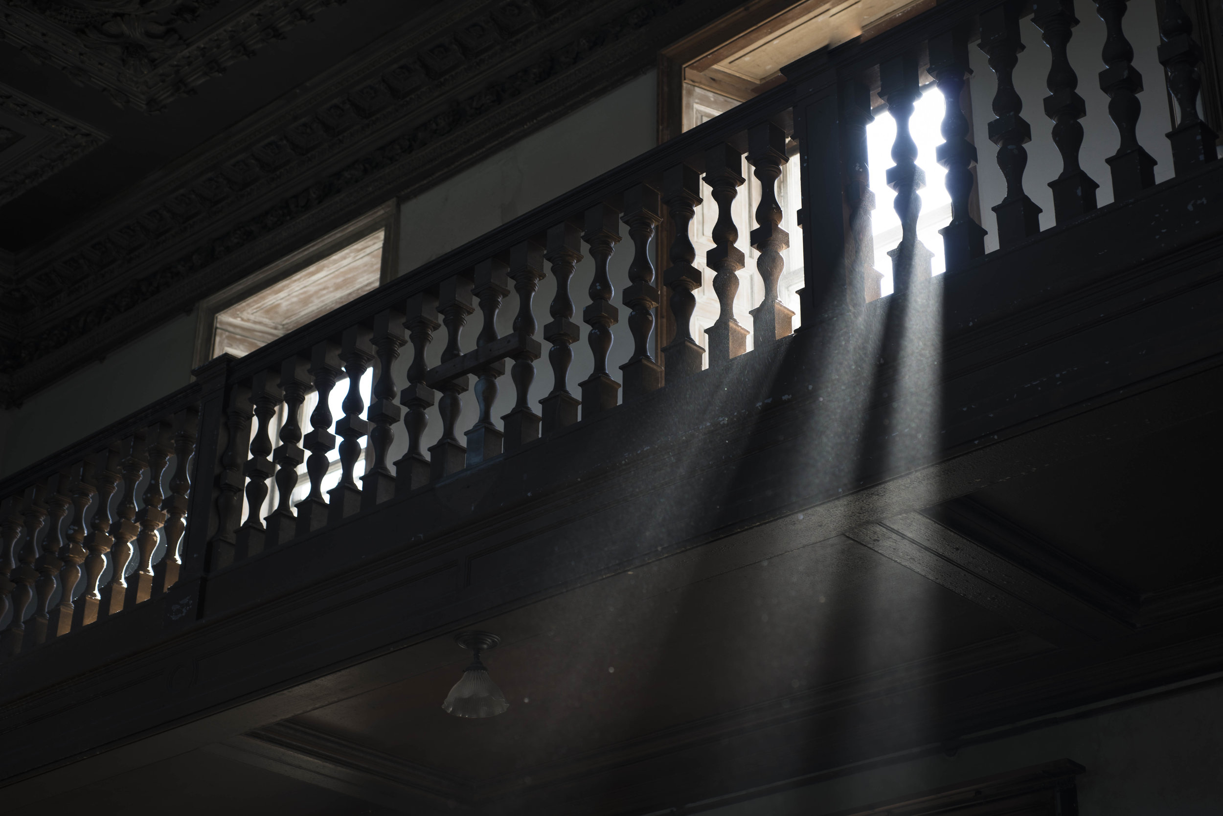 With so much of the building stripped bare, I looked at the way the light entered and interacted with the few remaining objects. I was fascinated by how much light would be let in by the windows only to fade before it even reached the other side of