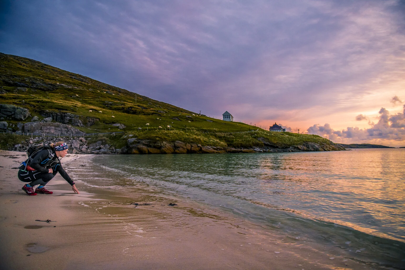 Laura touches the water at the start of the 158 mile Hebridean Way. Photo: Leo Francis/Rat Race Adventure Sports