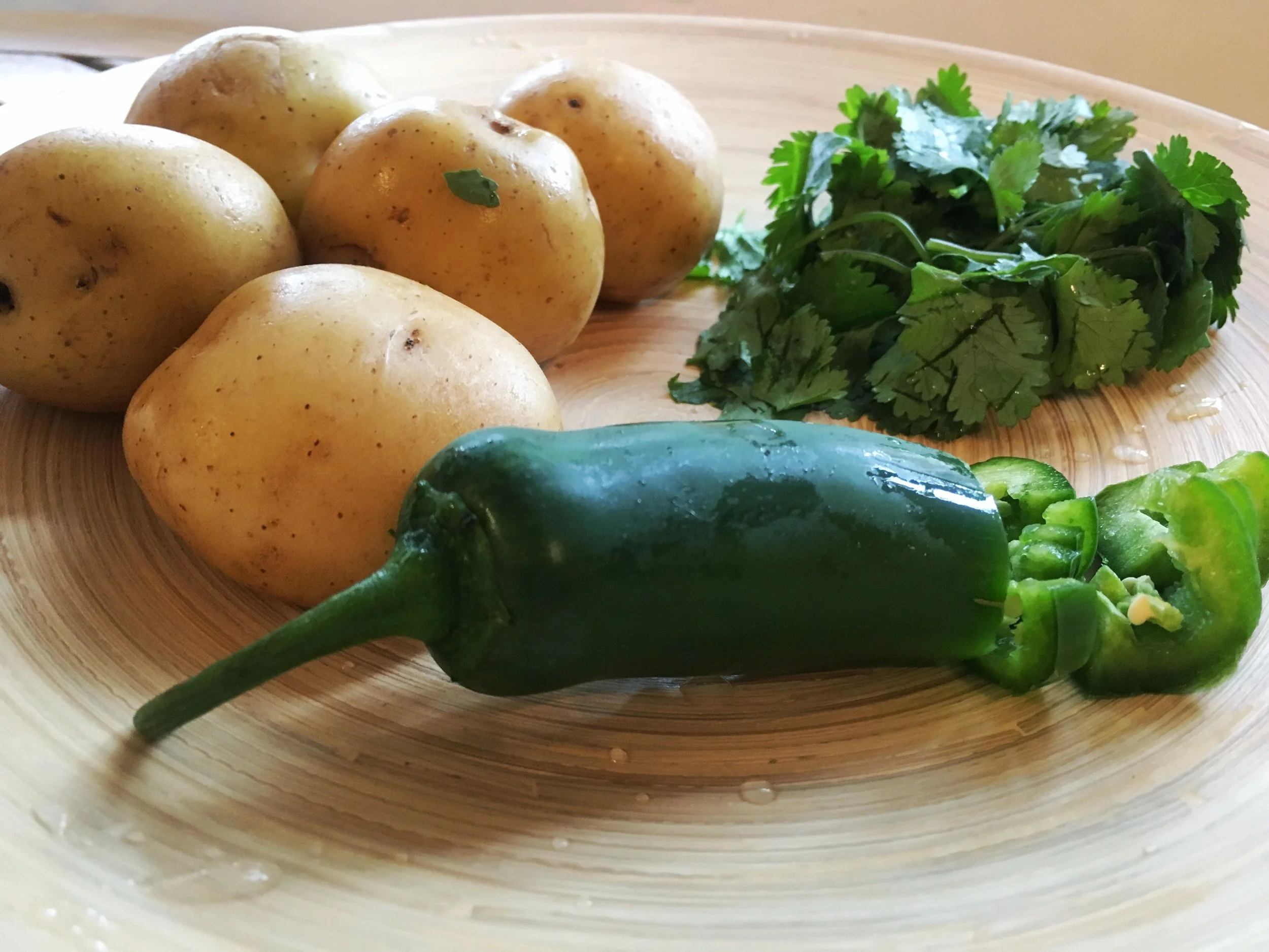 Roasted duck fat potatoes with jalapeno and cilantro