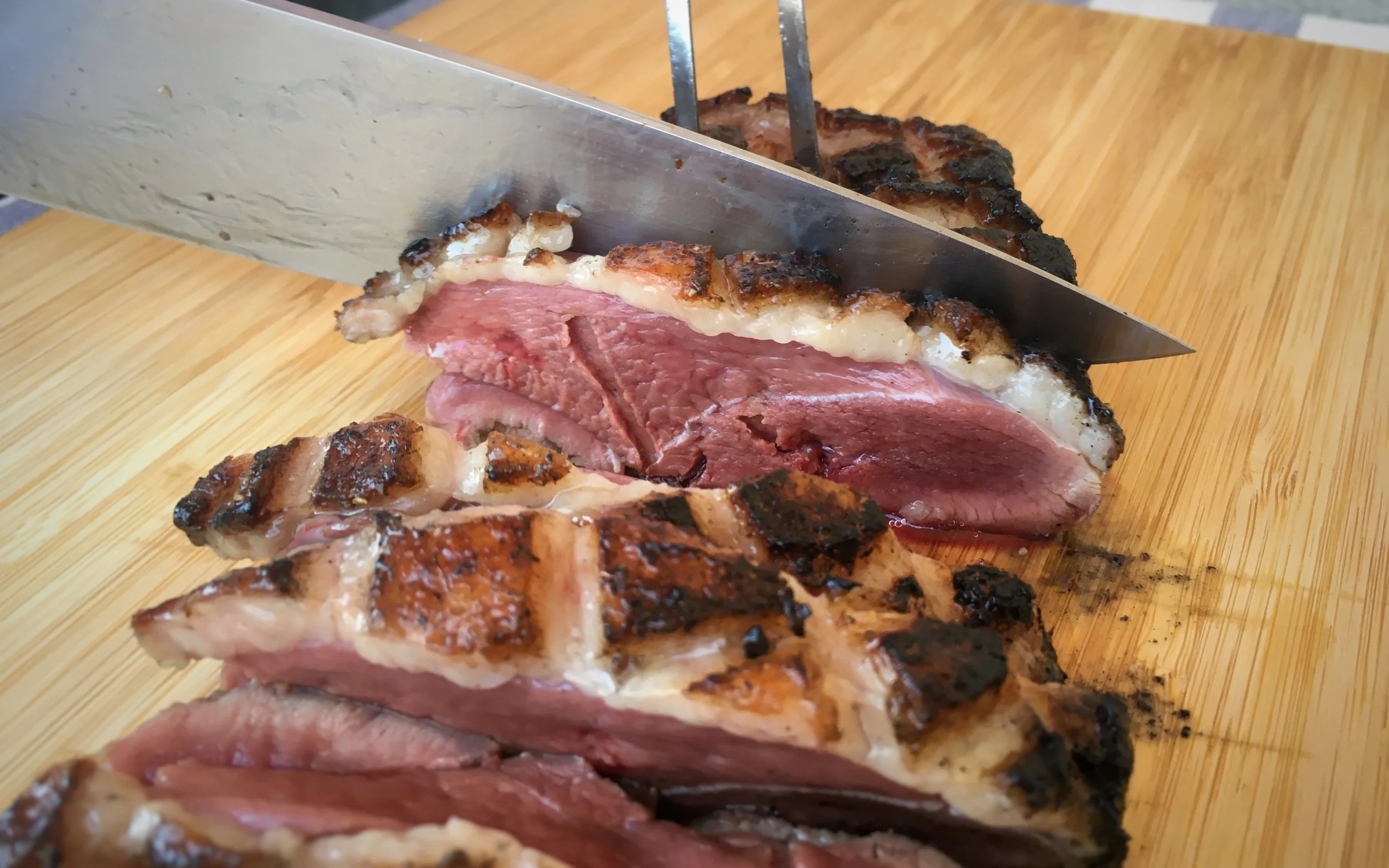 Medium rare duckchar moulard duck breast, sliced and ready-to-eat.