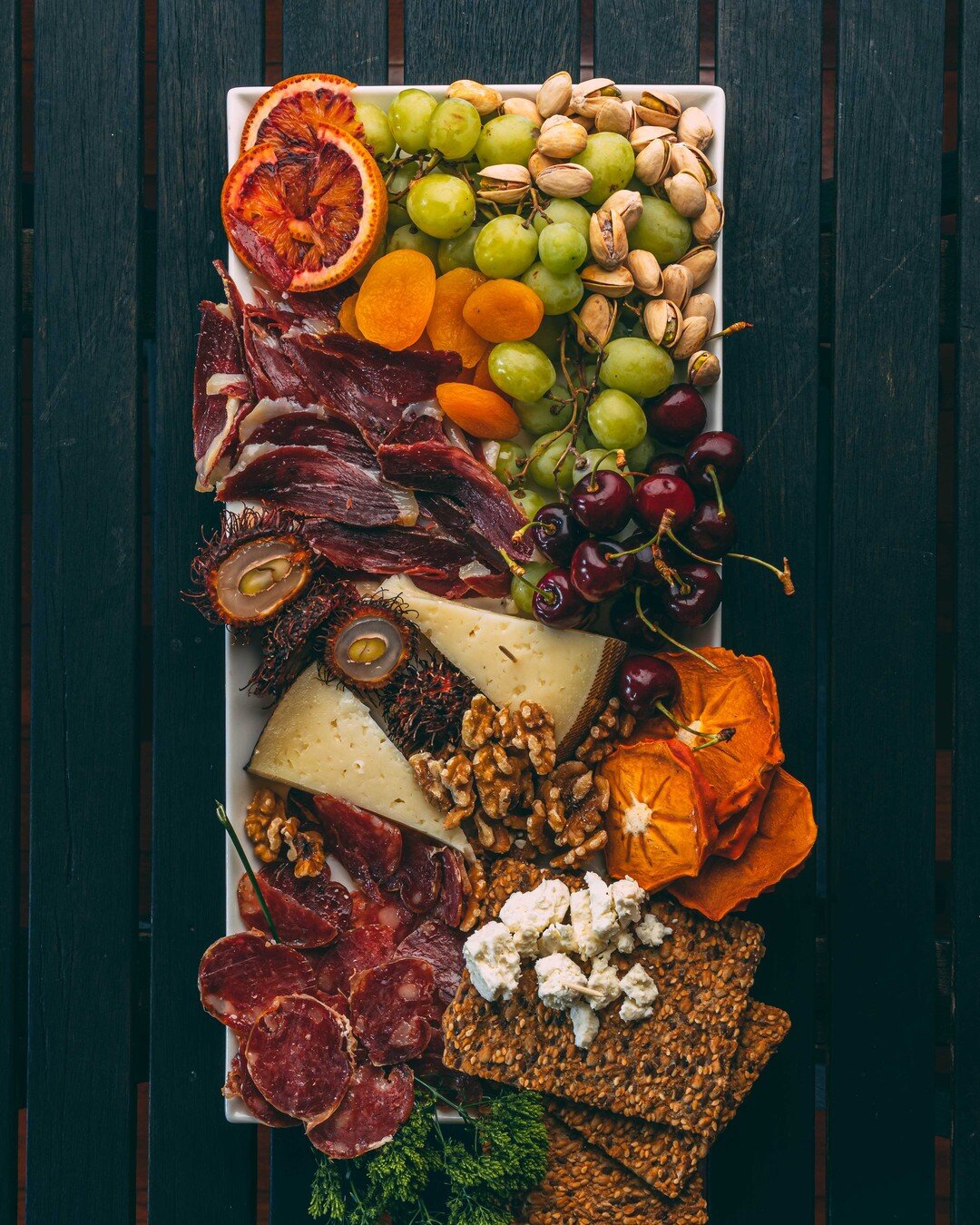 How do you make the perfect charcuterie board? First, switch it up. Everybody is tired of the same thing over and over again. This board is sprinkled with duck salami AND duck prosciutto. Second, avoid pre sliced cheeses. Trust us. Your friends and f