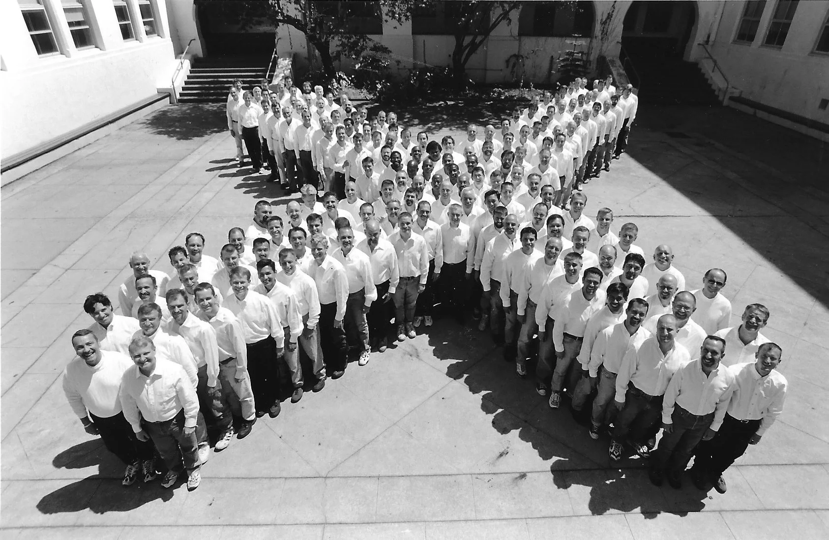 San Francisco Gay Men’s Chorus members gathered in a school courtyard.