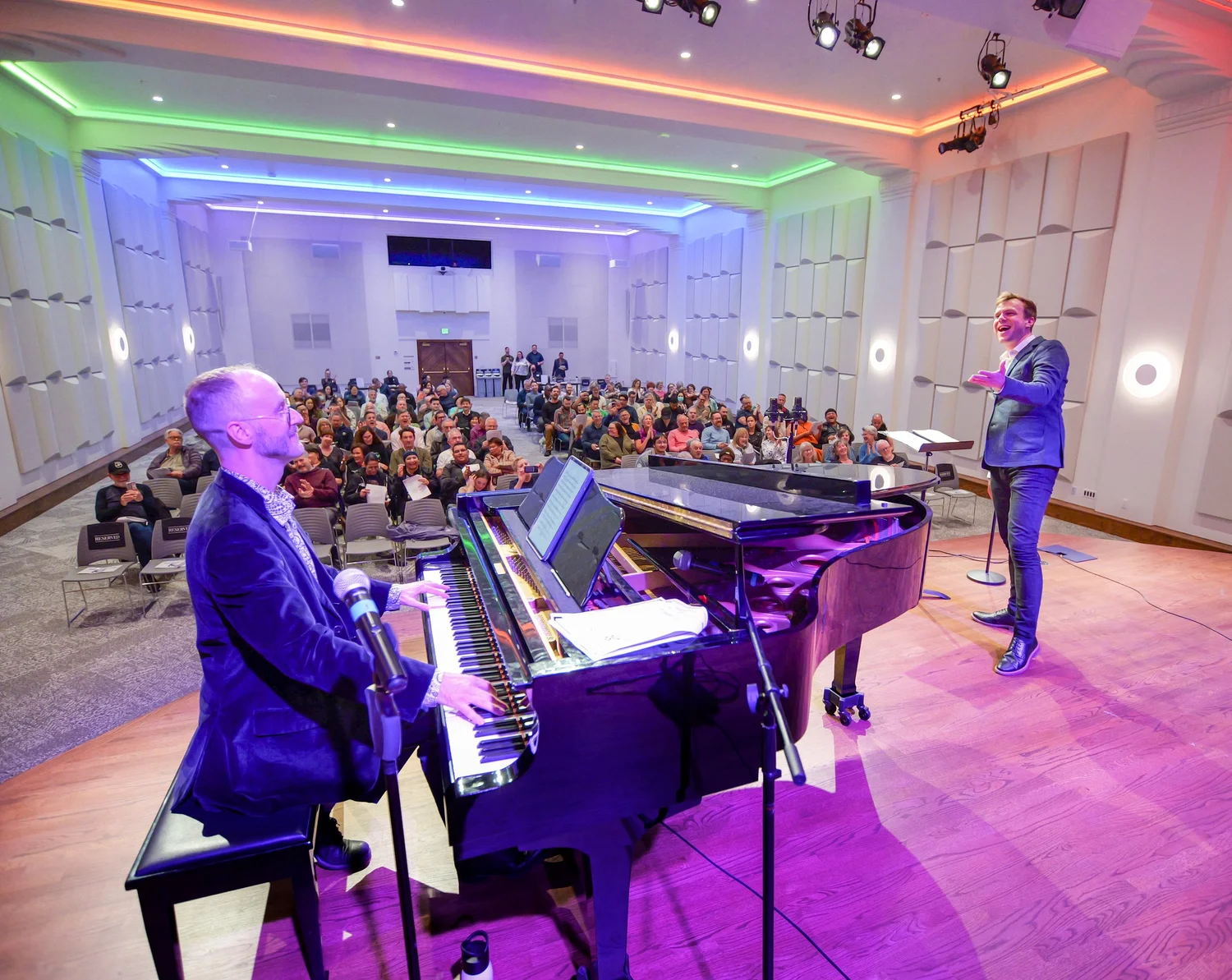 Audience and performers at an event inside The Chan National Queer Arts Center.