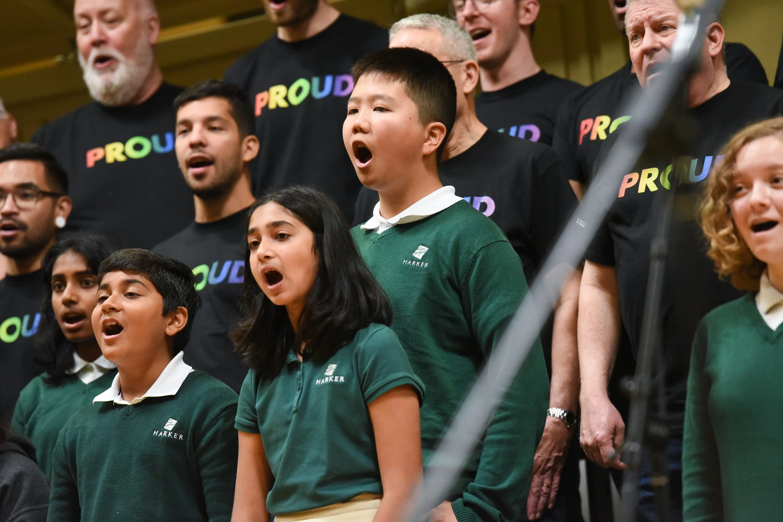 Students from Harker Middle School sing with members of SFGMC during a RHYTHM assembly.