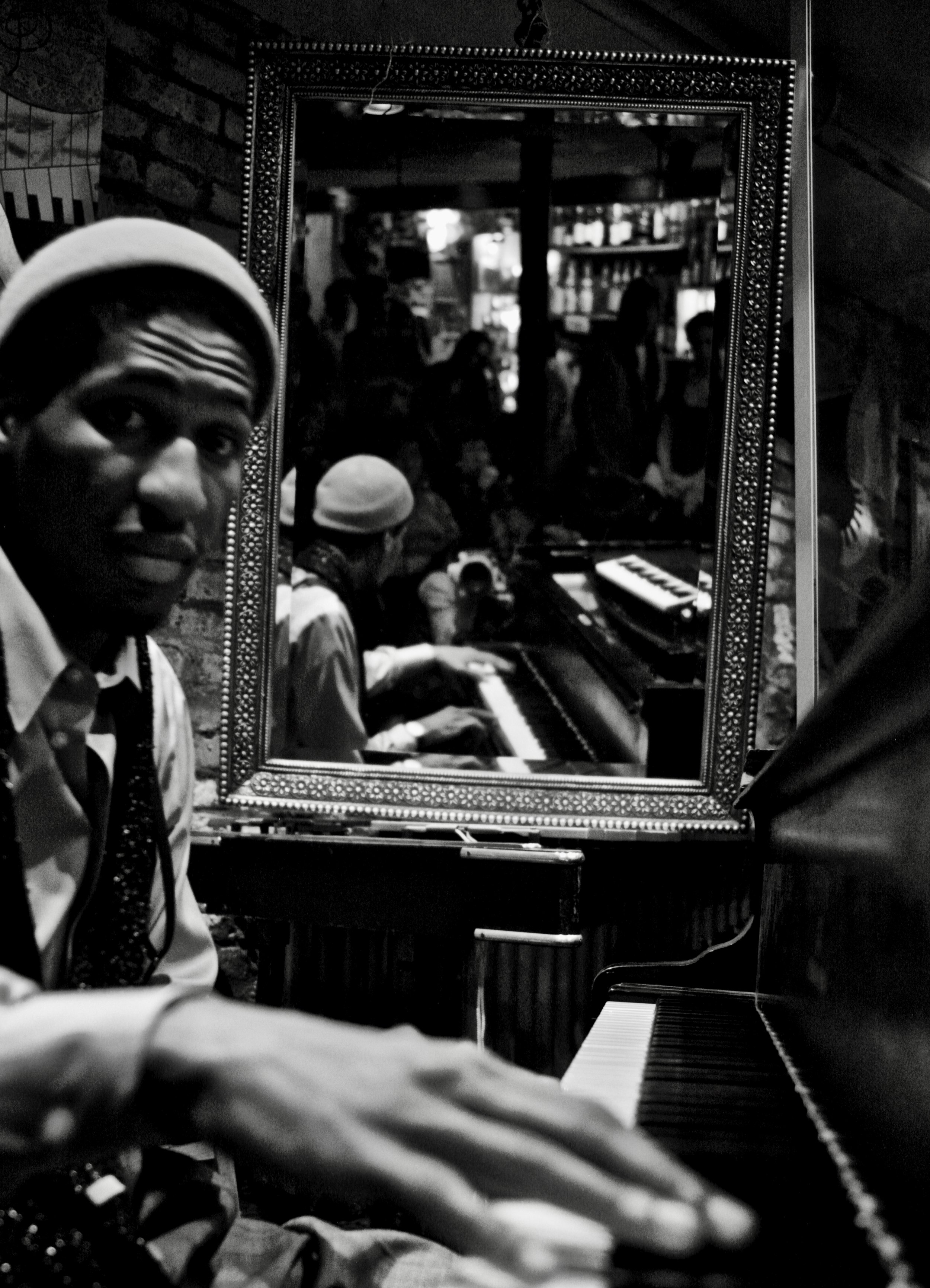 Jon Batiste (b. 1986) jamming with Roy Hargrove (1969-2018) at Smalls Jazz Club, Manhattan. This photo is from 2009-2010, when Batiste was the pianist for the Roy Hargrove Quintet.