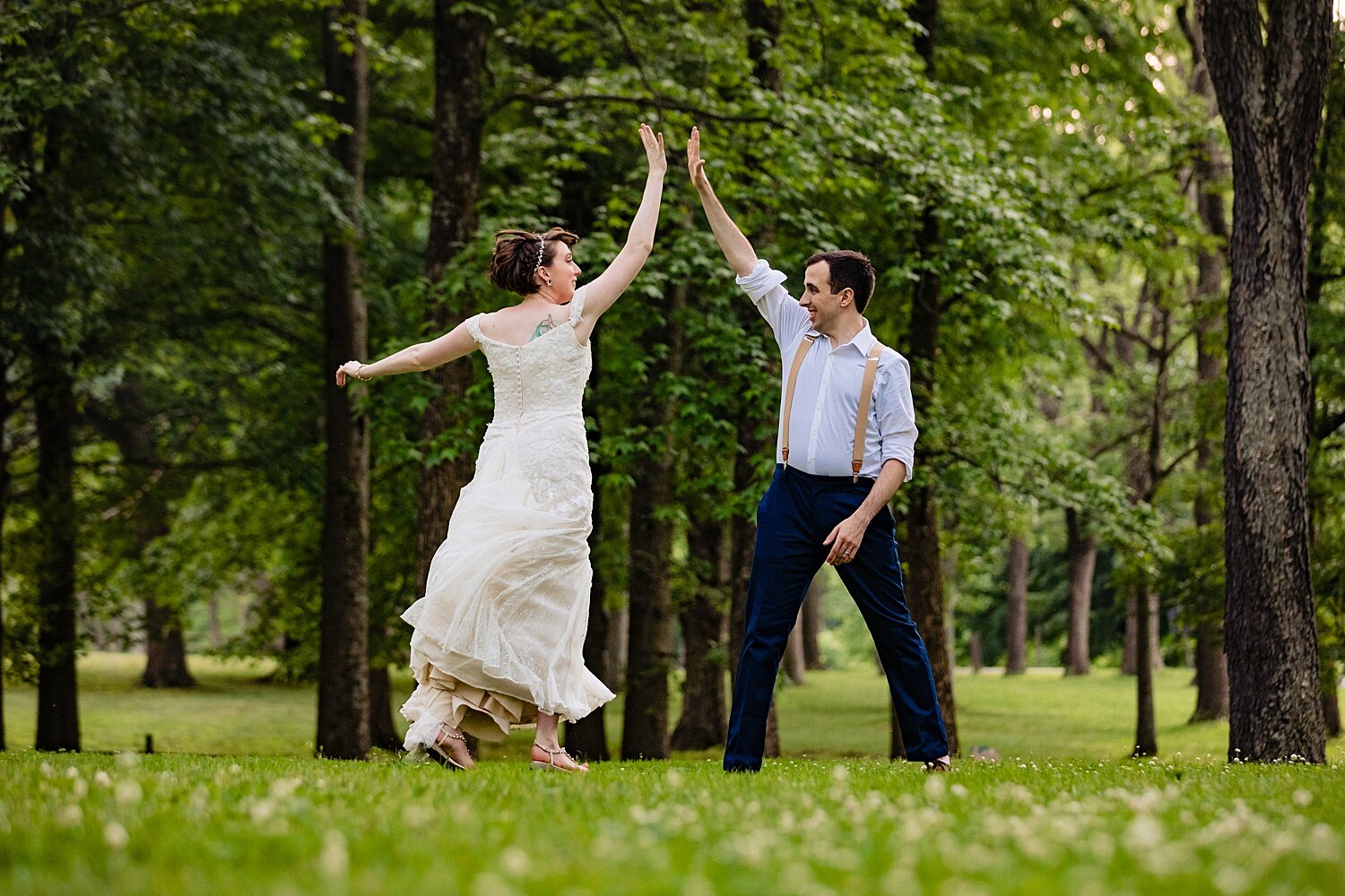 fun romantic playful couple jumping high five wedding photographer portrait Tinicum Park Wedding Bucks County Pennsylvania elopement casual