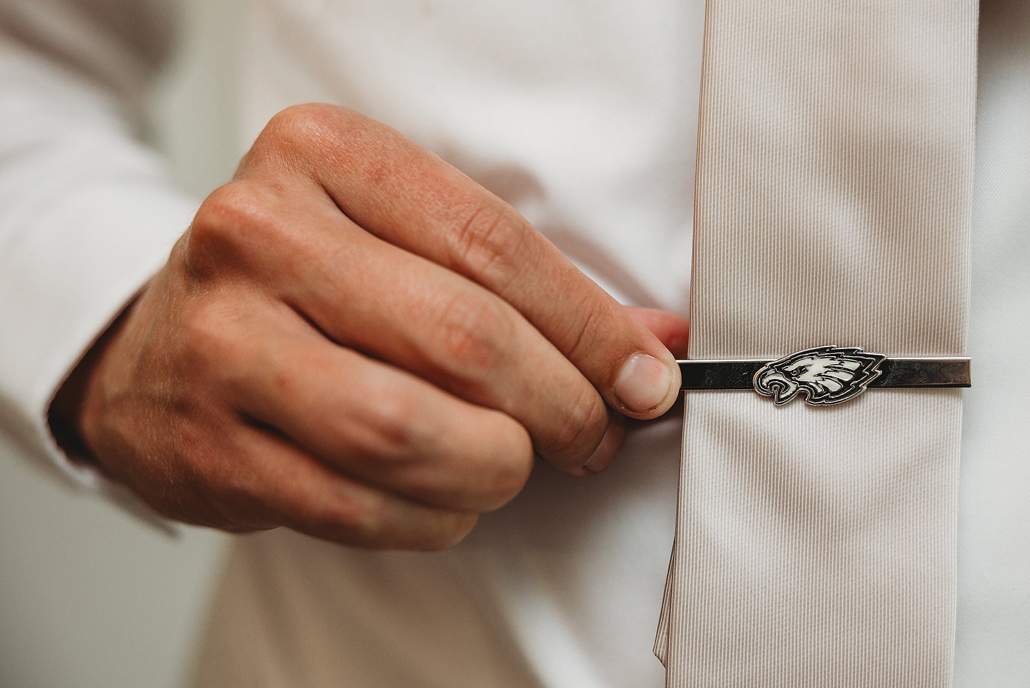 Ballroom at Ellis Preserve Newtown Philadelphia wedding photographer Eagles tie clip