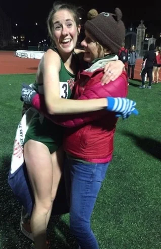 Post-race ecstasy! A giant bear hug from my mom after running 36:17 in the 10K.