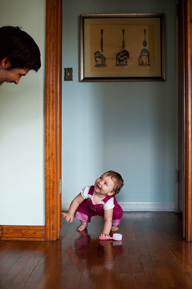 father and daughter play peek-a-boo