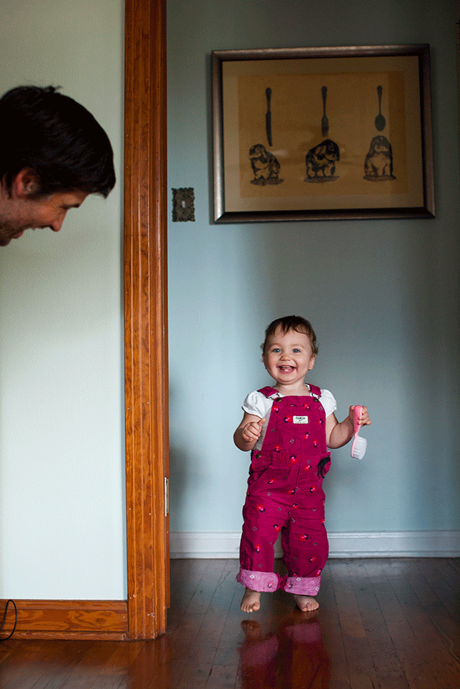 father and daughter play peek-a-boo