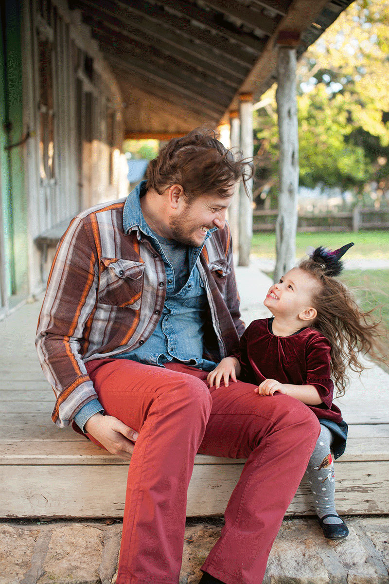 austin father and daughter cheesing together