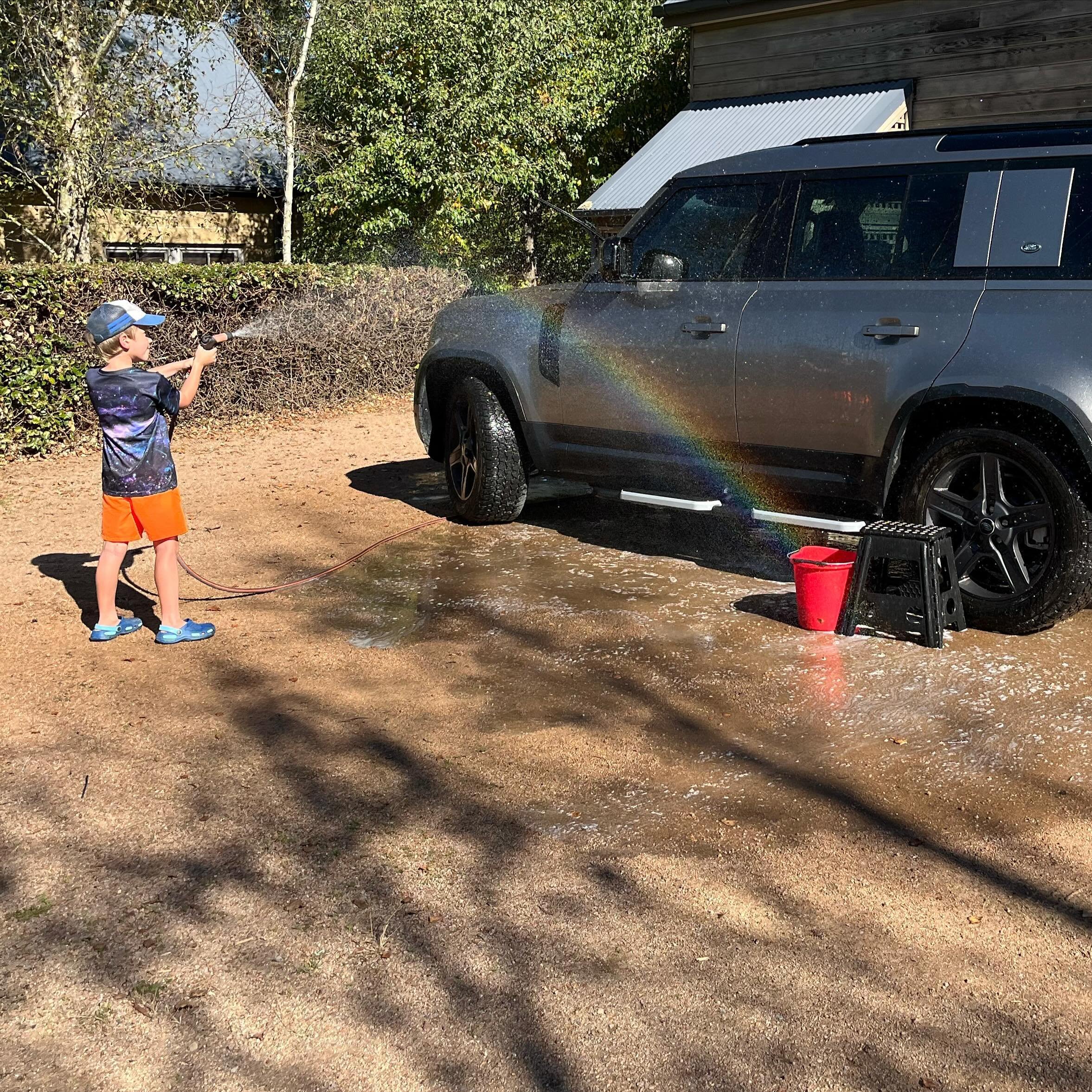 School holidays. And washing cars with rainbows 🌈 I never complain about aging because without aging I couldn&rsquo;t be a grandmother. Whatever form your family takes, spending time with little people is wonderful 💕 #sunshinethroughtherain