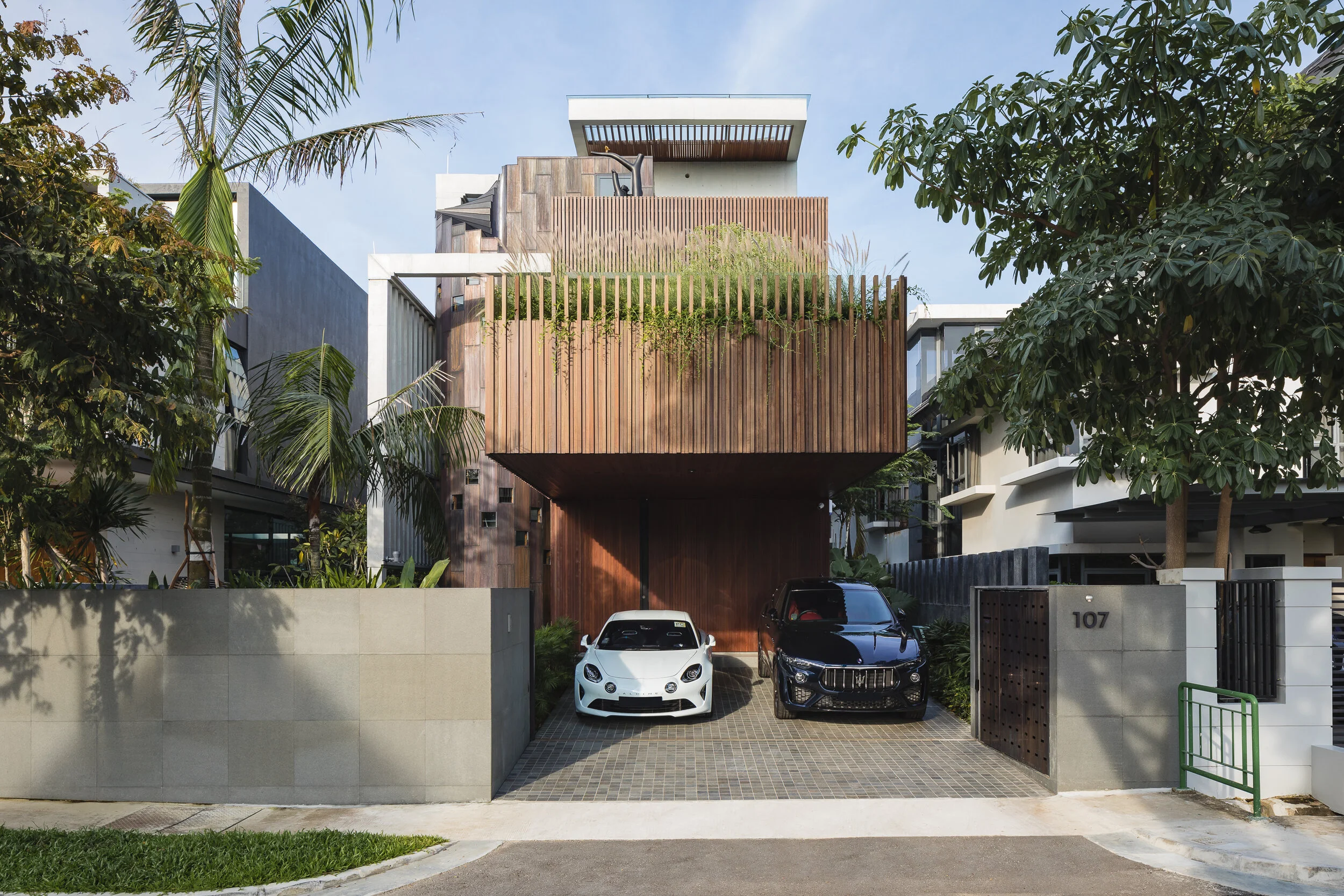 Architectural photograph of The Sculpted Space by HYLA Architects, highlighting its cantilevered timber façade, integrated greenery, and contemporary tropical residential design in Singapore.