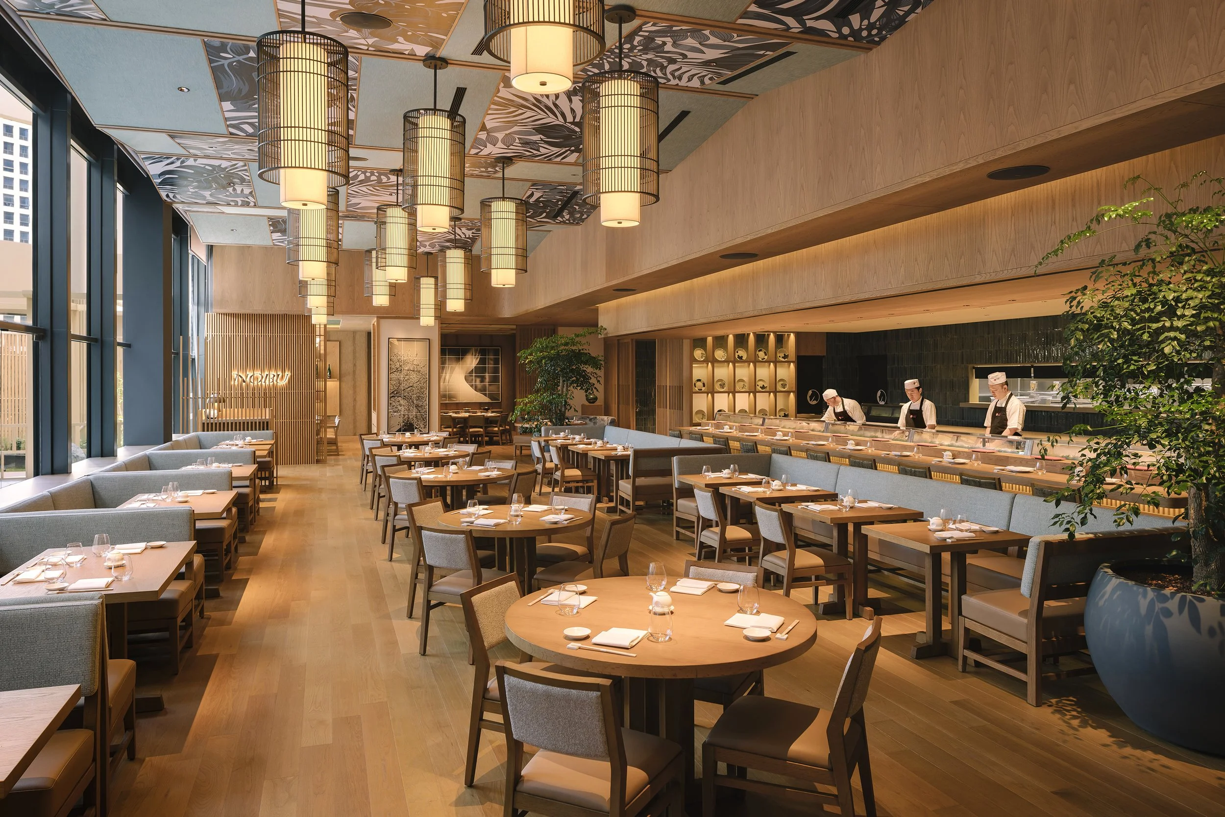 Nobu Singapore at Four Seasons Hotel Singapore, featuring the contemporary Japanese restaurant interior, sushi counter, bespoke lighting and luxury hospitality design. Interior photography by Daniel Koh.