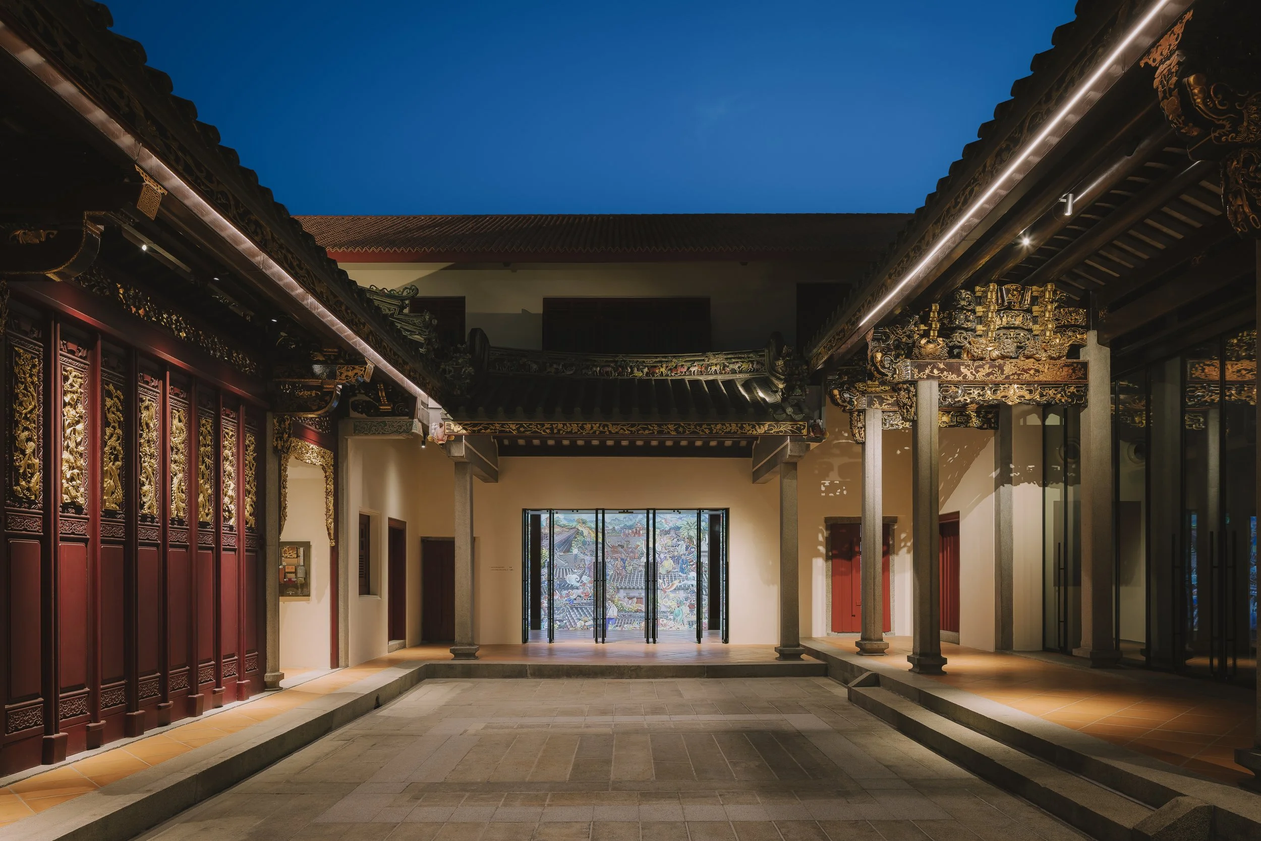 House of Tan Yeok Nee in Singapore, featuring the restored heritage courtyard, ornate carved timber details and traditional Chinese architecture. Architectural photography by Daniel Koh.
