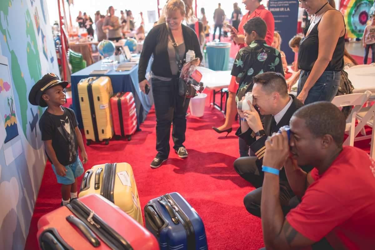 An awesome photo moment in the travel-inspired booth.