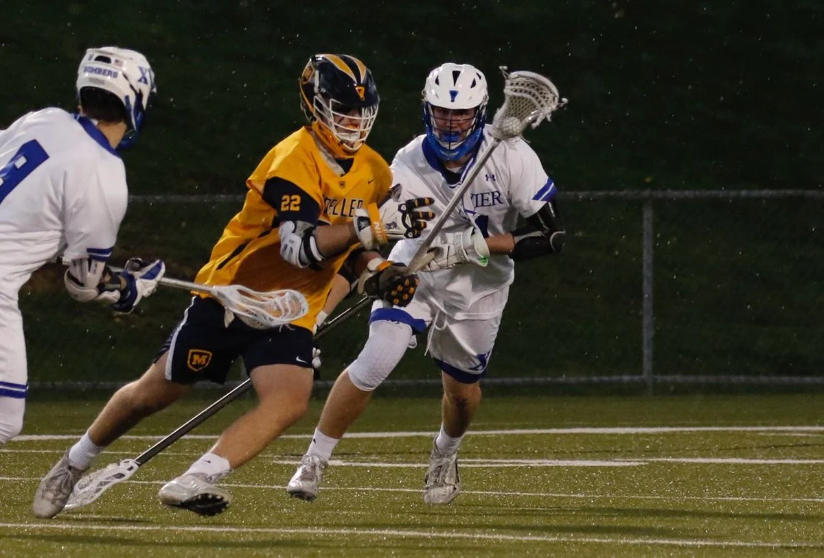 Moeller Senior Brendan Sigurdson attacking the Bombers photo taken by Mike LoveDay