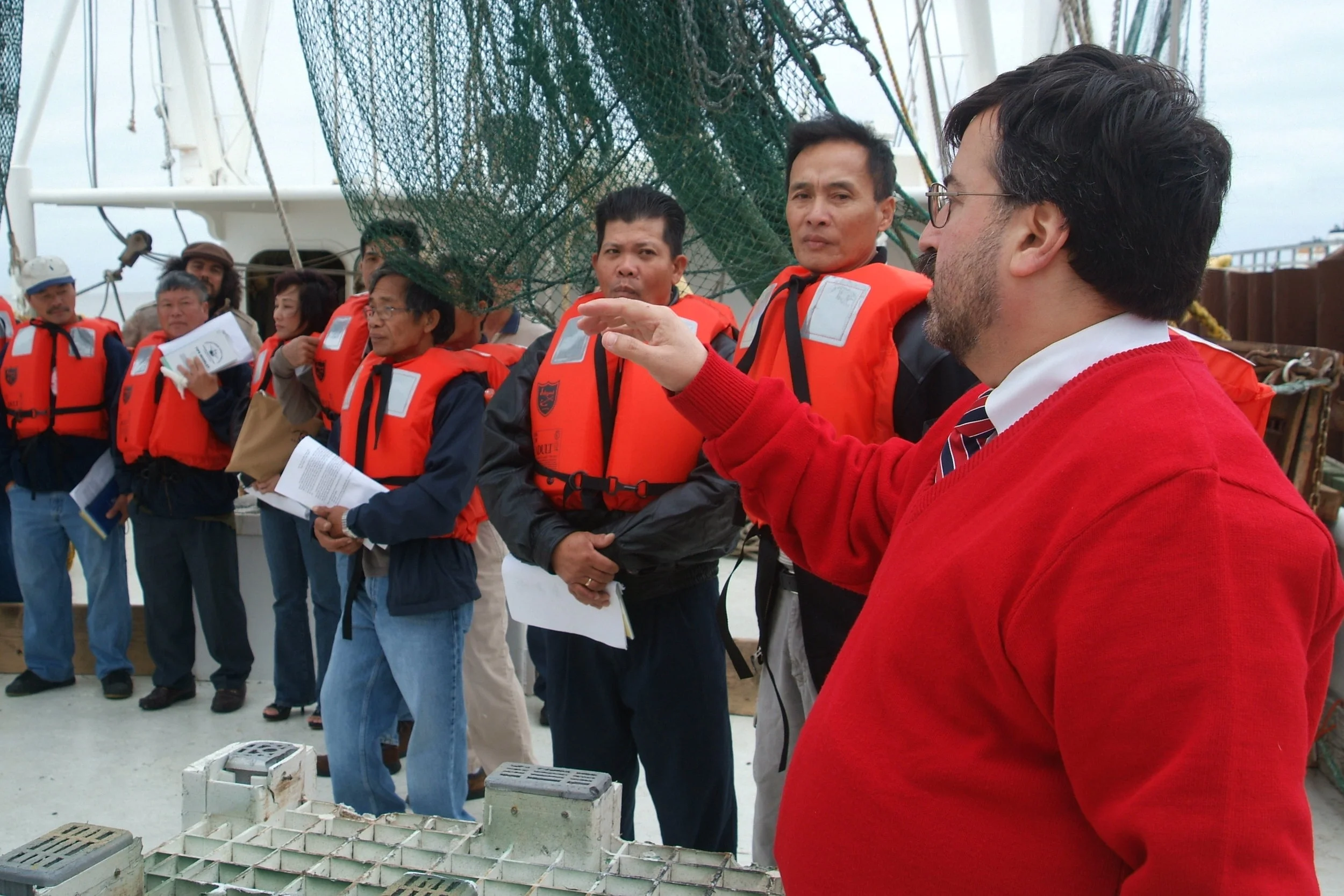 Dr. Jeff Levin (right) conducting a training with Vietnamese-American shrimp fishermen. 